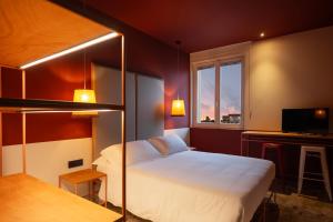 a hotel room with a bed and a window at Le Stanze Di Vittoria in Cesenatico