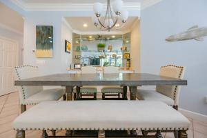 a dining room with a table and chairs at Phoenix on the Bay 1122 condo in Orange Beach