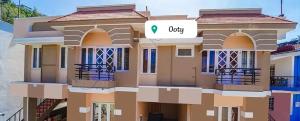 a rendering of a house with a qocity sign on it at FFF Cottage in Ooty +10 photos