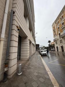 a car parked in a parking lot next to a building at Heart Of Bari in Bari