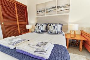 a bedroom with a bed with towels on it at Apartamentos São Rafael - Albufeira, Algarve in Albufeira +149 photos