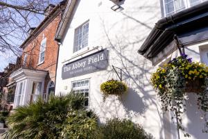 a sign on the side of a building at Abbey Fields By Chef & Brewer Collection in Kenilworth