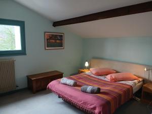 a bedroom with a bed with two pillows on it at Boningal in Moissac +40 photos