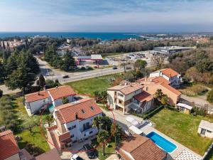 an aerial view of a small town with houses at Apartments Koraca in Poreč +11 photos
