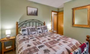 a bedroom with a bed with a quilt on it at Lawrences Hideaway in Wilmington