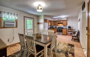 a kitchen with a dining room table and chairs at Lawrences Hideaway in Wilmington