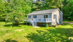 a small house in a yard with a porch at Lawrences Hideaway in Wilmington
