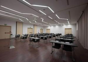 a large room with tables and chairs in it at Boutique Hotel Portorose in Portorož +109 photos