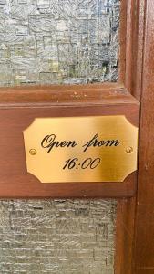 a sign that says open storm in a window at Comfort Doppelzimmer mit Balkon und Blick ins Grüne in Mespelbrunn