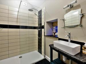 a bathroom with a sink and a shower at 3 Bed in Tyn Y Groes oc-80476 in Caerhûn +28 photos