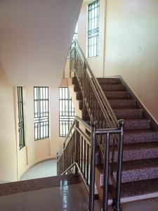 a spiral staircase in a building with windows at SARAB HOTEL Wau in Juba +2 photos