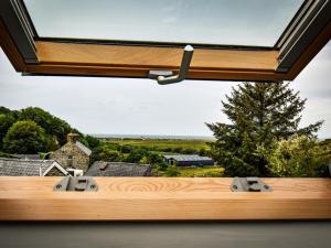 a view from the outside of a spa tub with a window at 3 Bed in Arthog oc-77304 in Arthog