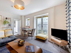 a living room with a couch and a table at 1 Bed in Aberaeron oc-49261 in Aberaeron
