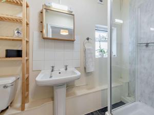 a bathroom with a sink and a shower at 1 Bed in Aberaeron oc-49261 in Aberaeron +22 photos