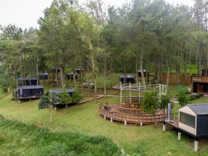 an aerial view of a park with a group of houses at Bobocabin Coban Rondo, Malang in Songgoriti