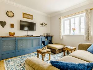 a living room with a couch and a tv at 1 Bed in Aberdare oc-82906 in Merthyr Tydfil