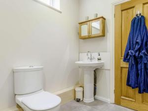 a bathroom with a toilet and a sink at 1 Bed in Aberdare oc-82906 in Merthyr Tydfil +17 photos