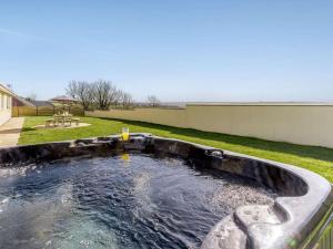 a large pool of water in a yard at 3 Bed in Clynderwen oc-73936 in Maenclochog