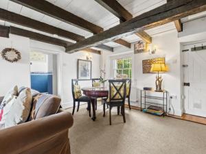 a kitchen and dining room with a table and chairs at 2 Bed in Swansea oc-88216 in Port-Eynon +22 photos