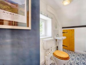 a bathroom with a toilet and a sink at 2 Bed in Swansea oc-88216 in Port-Eynon
