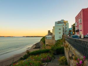 a view of a beach with buildings and flowers at 2 Bed in Tenby oc-fb284 in Tenby