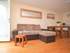 a living room with a couch and a table at 3 Bed in Narberth oc-36798 in Llawhaden +8 photos