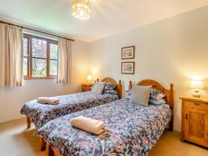 a bedroom with two beds and a window at 2 Bed in Haverfordwest oc-94123 in Trevine