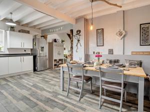 a kitchen and dining room with a table and chairs at 2 Bed in Swansea oc-78845 in Ilston