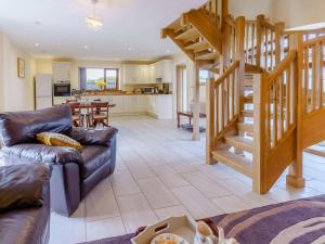 a living room with a couch and a staircase at 2 Bed in Lampeter oc-86507 in Cellan