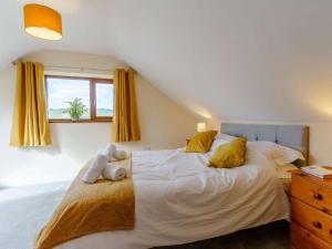 a bedroom with a bed with a teddy bear on it at 2 Bed in Lampeter oc-86507 in Cellan