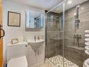 a bathroom with a shower and a sink at 2 Bed in Craven Arms oc-83166 in Clun +20 photos