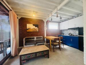 a kitchen with a table and a dining room at Sunsets at Sumbul in Pulukan