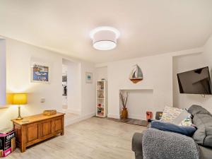 a living room with a couch and a tv at 4 Bed in Cardigan oc-94137 in Aberporth