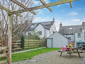 a picnic table in the yard of a house at 4 Bed in Cardigan oc-94137 in Aberporth