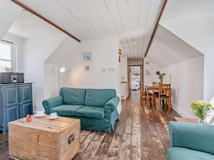 a living room with two green couches and a table at 1 Bed in New Quay oc-45927 in New Quay