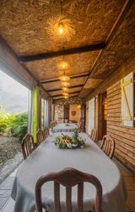 a dining room with a table and some chairs at Le Taïbit in Cilaos