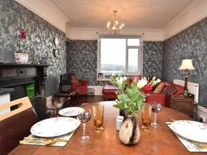 a living room with a table and a couch at 1 Bed in Goodwick oc-fb158 in Goodwick