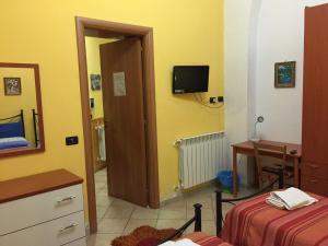 Televízia a/alebo spoločenská miestnosť v ubytovaní Holiday home Linguaglossa/Sizilien 23272