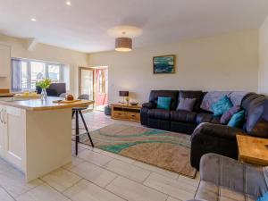 a living room with a couch and a table at 3 Bed in Lampeter oc-86506 in Cellan +16 photos