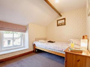 a bedroom with a bed and a window at 2 Bed in Colwyn Bay oc-50933 in Eglwys-Fâch +16 photos