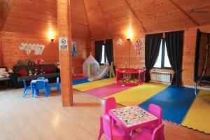 a living room with a play room with a play table at Everest Rest House in Tsaghkadzor