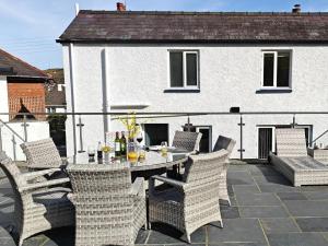 a table and chairs sitting on a patio at 3 Bed in Aberaeron oc-95971 in Aberaeron