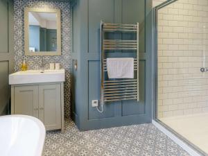 a bathroom with a sink and a toilet and a shower at 3 Bed in New Quay oc-83998 in New Quay +18 photos