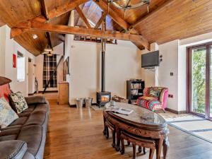 a living room with a couch and a table at 1 Bed in Swansea oc-74221 in Ilston