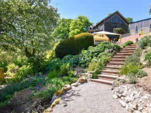 a garden with stairs and flowers in front of a house at 4 Bed in Newtown oc-48641 in Kerry