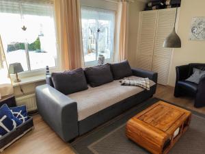 a living room with a couch and a coffee table at Ferienwohnung Seerose mit Terrasse in Sassnitz