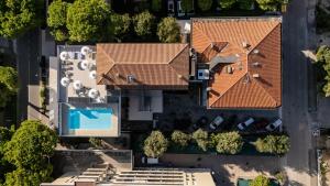 an overhead view of a house with a roof at Olimpia Hotel & Aparthotel in Bibione +116 photos