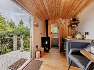 a tiny house with a kitchen and a stove at 1 Bed in Welshpool oc-92796 in Welshpool