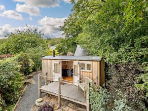 a tiny house with a porch and a deck at 1 Bed in Welshpool oc-92796 in Welshpool