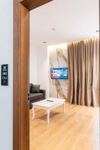 a living room with a coffee table and a couch at Hotel Siars in Ksamil